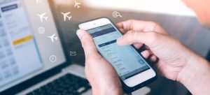 Flight booking, Hand holding mobile phone with Online booking, Traveler